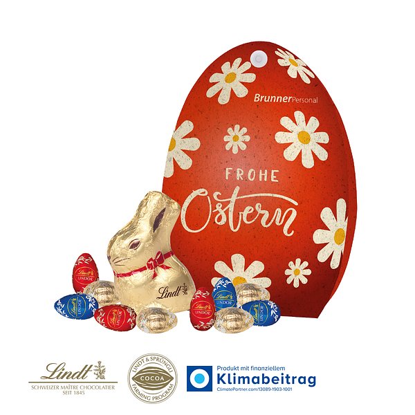 Werbe-Osterei mit Goldhase und Schoko-Eier von Lindt auf Graspapier